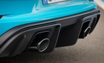 <p>The dual exhaust outlets all flow from one big muffler that straddles the diffuser like a big metal saddle.</p>