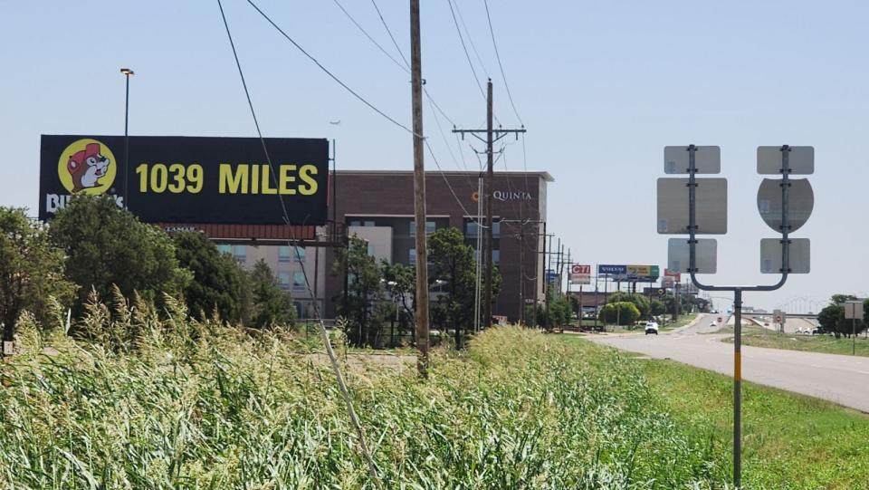 A billboard sign advertises a Buc-ee's location 1,039 miles away in Amarillo. The sign is located off of I-40, west of the Lakeside exit on the northside of the city, across from the Travel Information Center. An Amarillo Buc-ee's location is still in the works, according to officials.