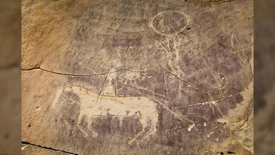  A petroglyph of a horse and rider, likely created by the ancestral Comanche or Shoshone people. This carving was found at the Tolar site in Sweetwater County, Wyoming. 