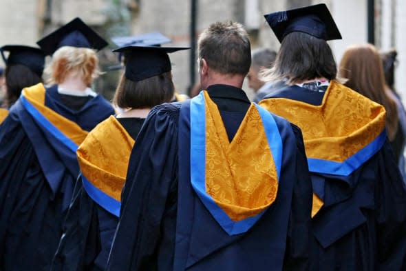 File photo dated 12/10/11 of a general view of students wearing mortar boards and gowns after graduating as would-be students are more likely to decide where to go to university based on job opportunities rather than the prospect of a decent social life. PRESS ASSOCIATION Photo. Issue date: Tuesday March 11, 2014. Almost two thirds (63%) of university applicants say that improving their work chances or pursuing a specific vocation was their main reason for going into higher education, according to a new poll by Which? But less than 1% said that their number one reason for studying for a degree was to have a good social life. See PA story EDUCATION Universities. Photo credit should read: Chris Radburn/PA Wire