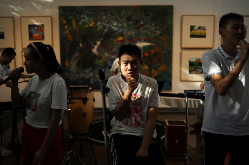 The Wider Image: "Music is their language": school gives autistic Chinese youth a voice