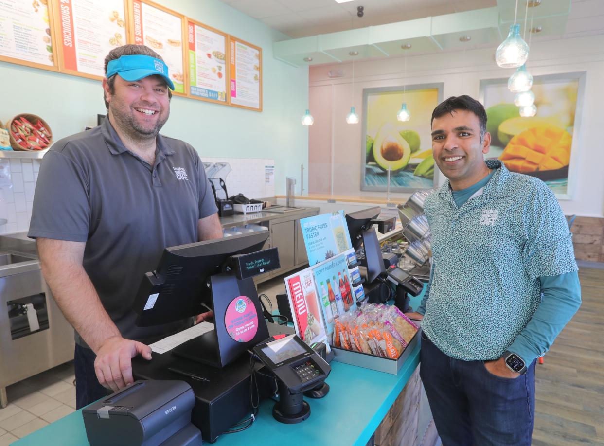 Tropical Smoothie Cafe District Manager Erich Torok, left, and owner Gaurav Aggarwal at the cafe's new Wallhaven location in Akron on Wednesday. The smoothie spot held a soft opening Monday.