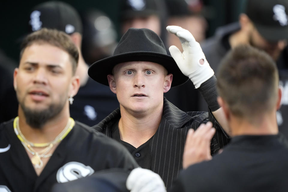 Chicago White Sox's Andrew Vaughn is greeted in the dugout after a two-run home run during the fifth inning of a baseball game against the Detroit Tigers, Friday, May 26, 2023, in Detroit. (AP Photo/Carlos Osorio)