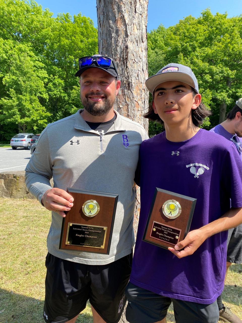 Nathan Kim, right, poses with his coach, Ben Brewer, after Kim toppled BBA's Nick O'Donnell to seize the high school boys tennis singles state title at Leddy Park on Saturday, May, 27, 2023.