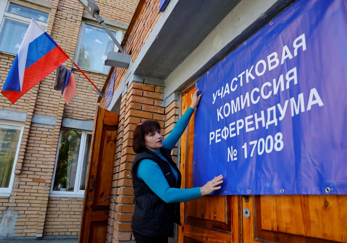 A being hung on the doors of a polling station ahead of the ‘sham' referendum in Donetsk (REUTERS)