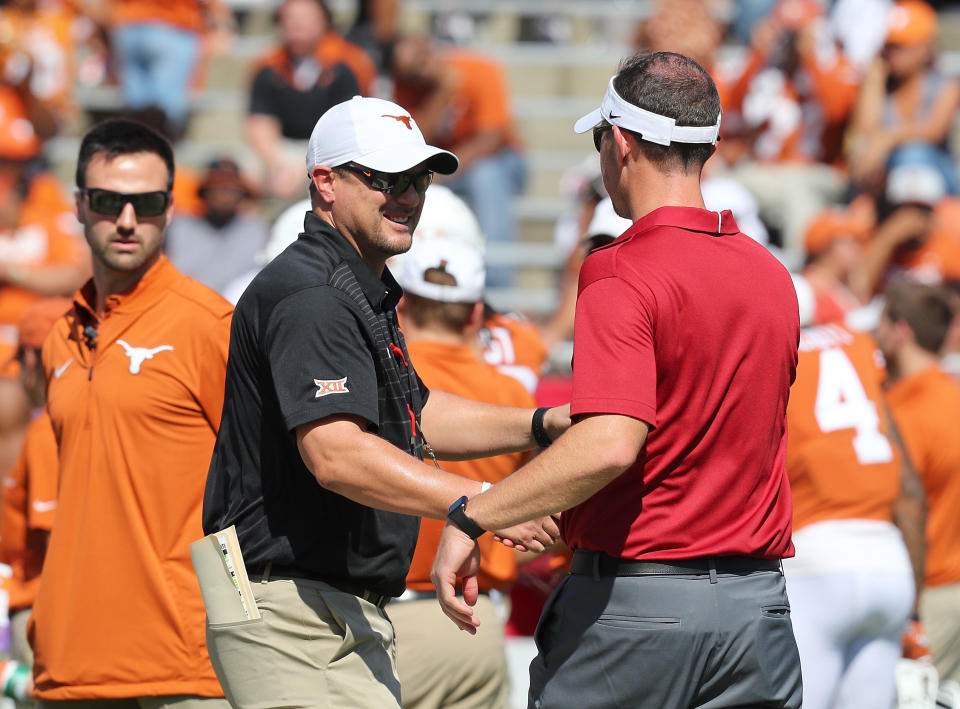 DALLAS, TX - OCTOBER 14:  Head coach Tom Herman of the Texas Longhorns  shakes hands with head coach Lincoln Riley of the Oklahoma Sooners before the football game at Cotton Bowl on October 14, 2017 in Dallas, Texas.  (Photo by Richard Rodriguez/Getty Images)