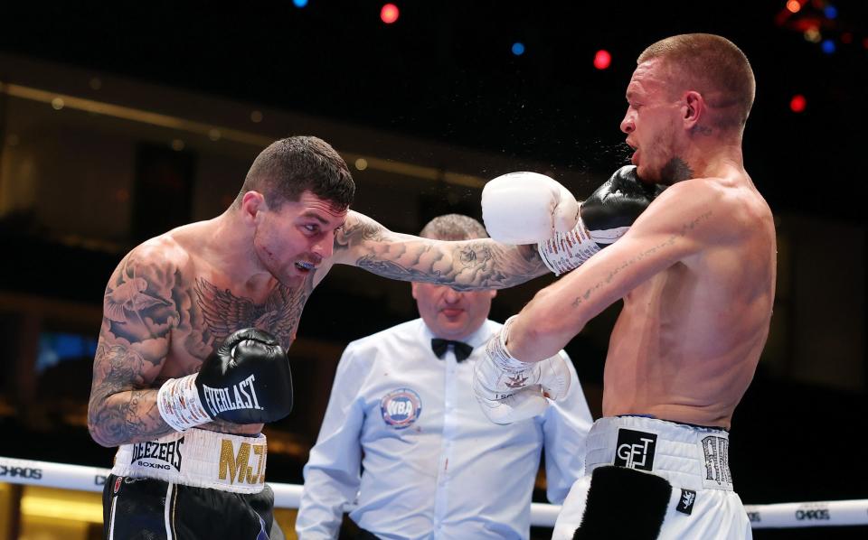 Mark Chamberlain punches Gavin Gwynne during the WBA International Lightweight title fight between Mark Chamberlain and Gavin Gwynne on the Knockout Chaos boxing card at the Kingdom Arena on March 08, 2024 in Riyadh, Saudi Arabia