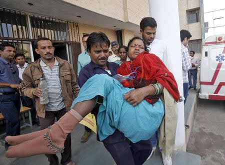 A woman, who underwent a sterilization surgery at a government mass sterilisation "camp", is shifted to a private hospital from the Chhattisgarh Institute of Medical Sciences (CIMS) hospital in Bilaspur, in the eastern Indian state of Chhattisgarh, November 13, 2014. REUTERS/Anindito Mukherjee