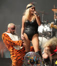 Ke$ha was surrounded by dancers in animal costumes as she took to the stage in her revealing bodysuit [PA]