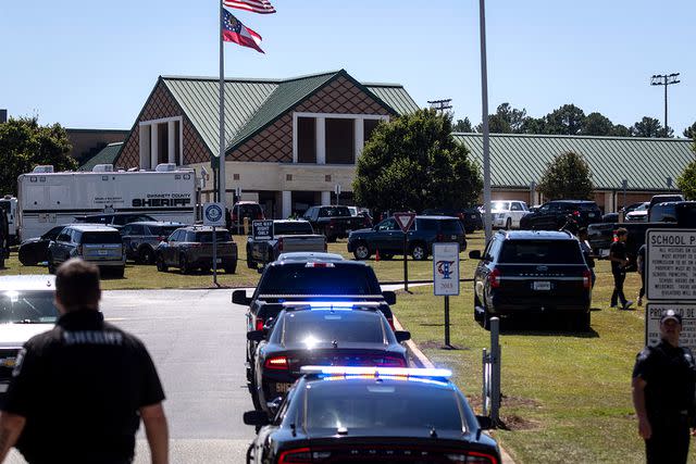 <p>CHRISTIAN MONTERROSA/AFP via Getty</p> Law enforcement and first responders respond to Apalachee High School in Winder, Georgia, on September 4, 2024, after a shooting was reported. Police took a suspect into custody after the shooting on Wednesday, with students evacuated from the scene and local media reporting fatalities. CNN, citing unnamed law enforcement sources, reported that four people had been killed and 30 wounded. Other outlets reported two deaths.