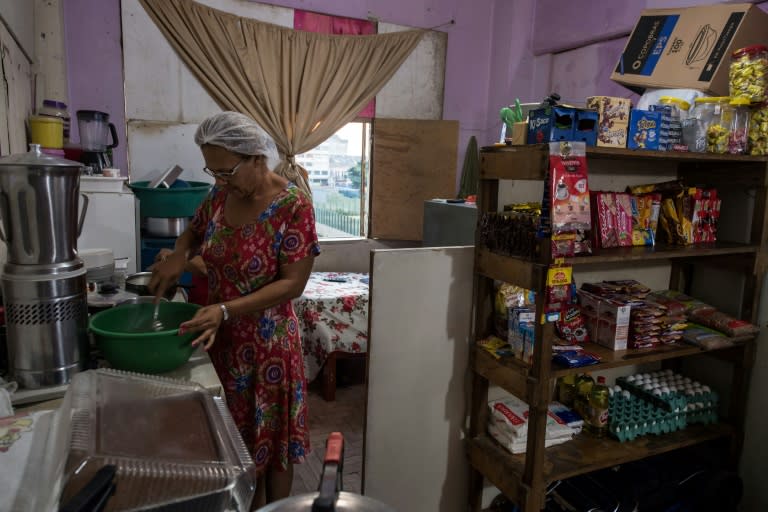 Marcia Goncalves, a squatter in Sao Paulo's Prestes Maia building, makes a living selling sweets and rinks from a small shop set up in her kitchen