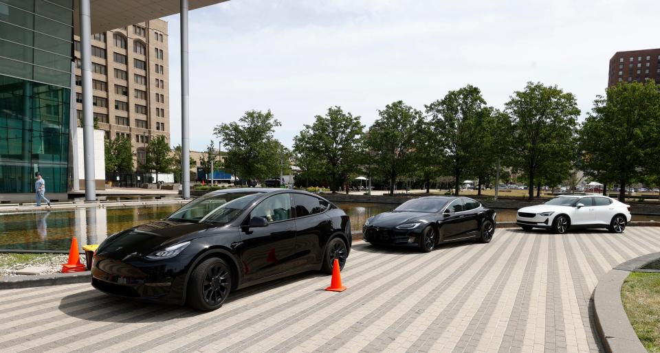 Two Teslas, left, and a Polestar 2 sit waiting for participants during the DTE ride and drive of various electric cars and pickup trucks at DTE headquarters in Detroit on June 25, 2022