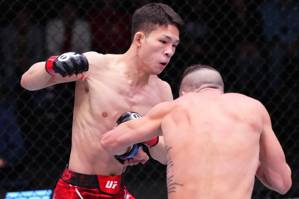 LAS VEGAS, NEVADA – DECEMBER 09: (L-R) HyunSung Park of South Korea punches Shannon Ross of Australia in a flyweight fight during the UFC Fight Night event at UFC APEX on December 09, 2023 in Las Vegas, Nevada. (Photo by Jeff Bottari/Zuffa LLC via Getty Images)