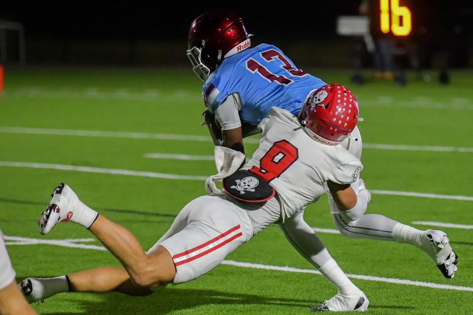 Savannah's Christian’s David Bucey drops Carver’s Kei’Mauri Mile for a one-yard loss on Carver’s first series of the 2023 GHSA 3A Football Semifinal game Friday, December 1, 2023, at Otis Spencer Stadium in Columbus, Georgia. (Courtesy Columbus Ledger-Enquirer)