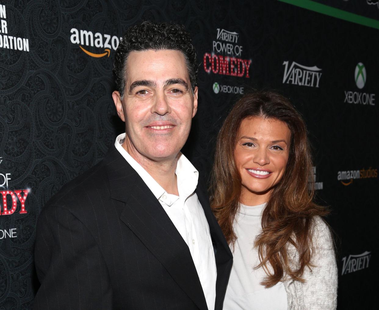 Comedian Adam Carolla and Lynette Paradise attend Variety's 4th Annual Power of Comedy presented by Xbox One benefiting the Noreen Fraser Foundation at Avalon on November 16, 2013 in Hollywood, California. 