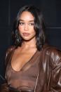 <p> Laura Harrier has a few different curl styles going on here and they all work in harmony together. Capture her look by using a few different sized curling barrels or allow some to set for longer than others and brush out with a comb. </p>