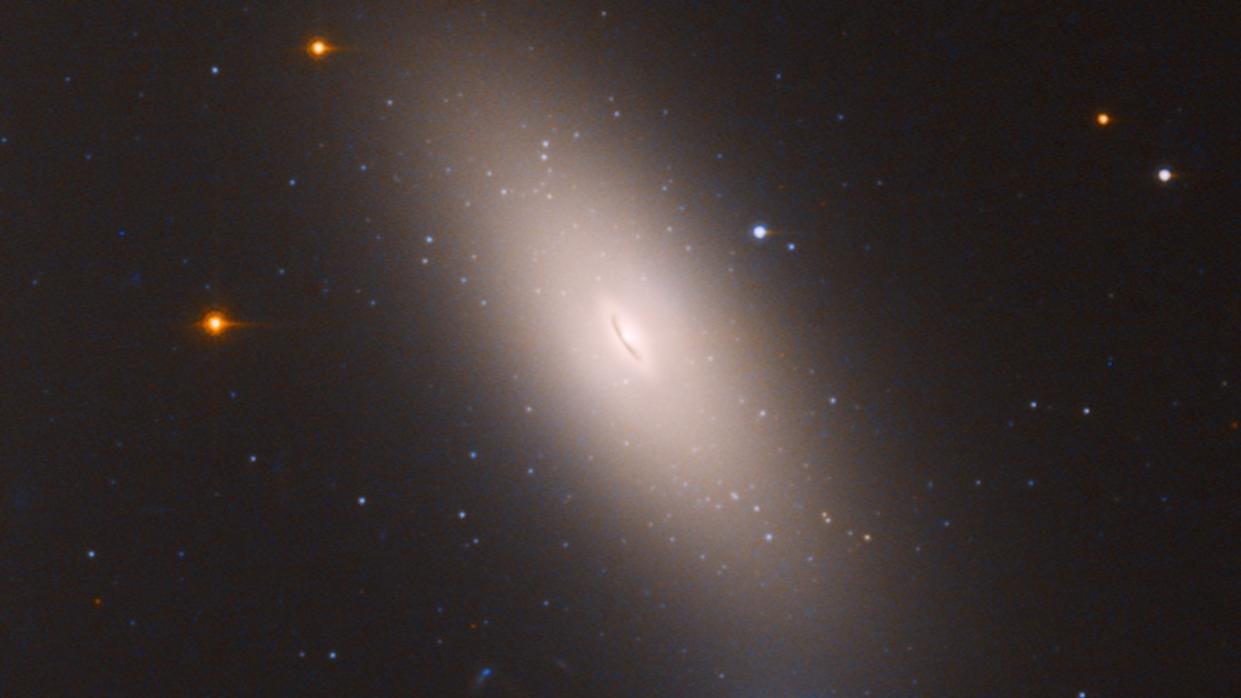  A galaxy with an exceptionally bright, stretched-out disk of light around it 