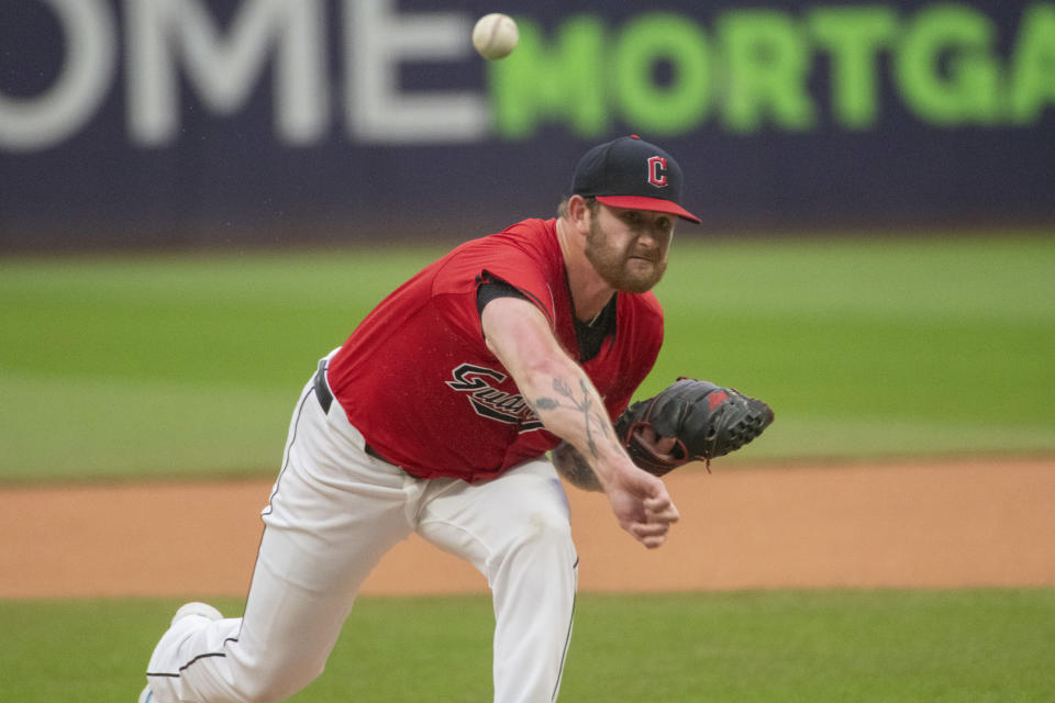 Cleveland Guardians starting pitcher Ben Lively delivers against the Houston Astros during the first inning of a baseball game in Cleveland, Saturday, Sept. 28, 2024. (AP Photo/Phil Long)