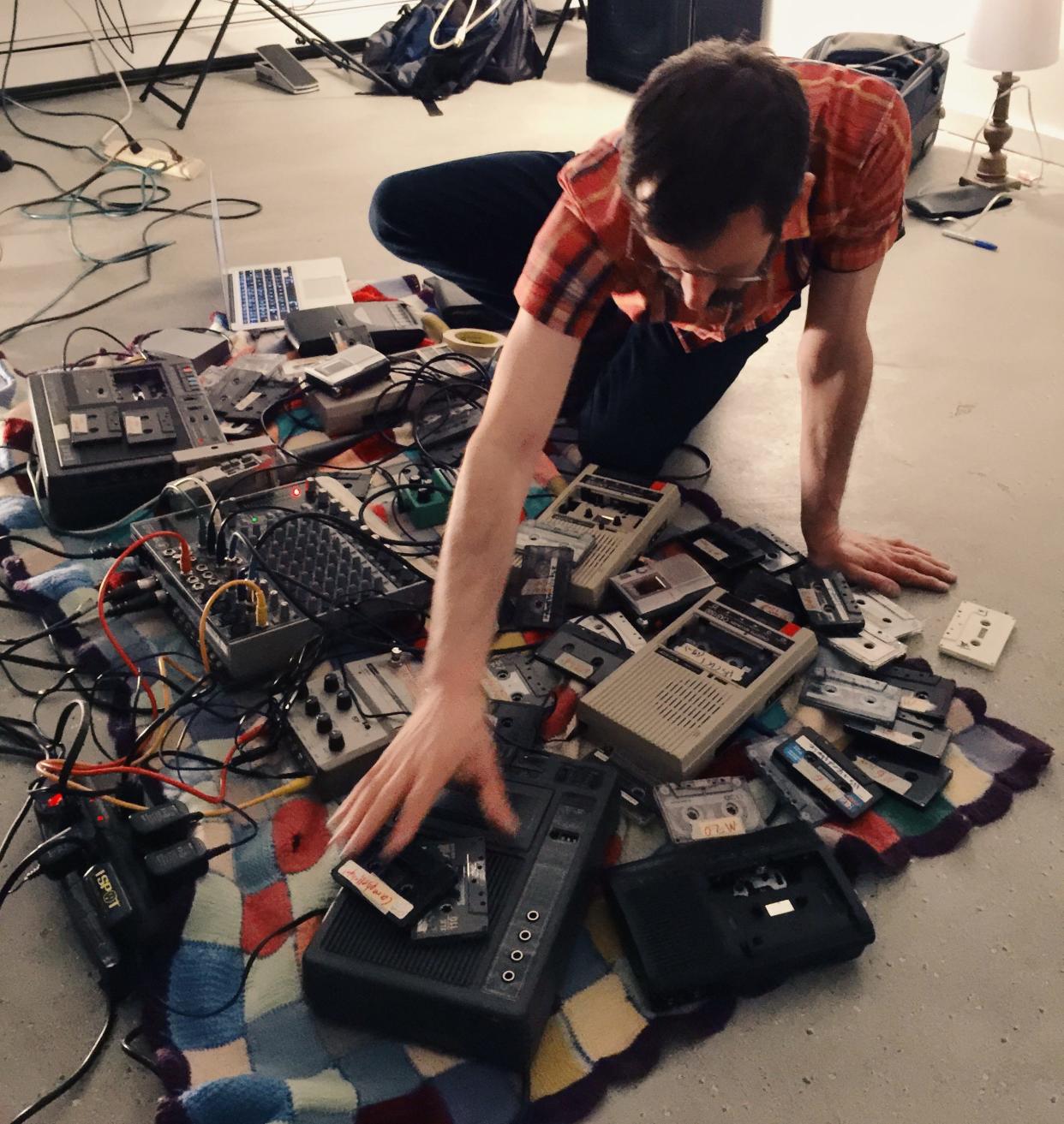 Howard Stelzer performs with his arsenal of cassette tapes and decks at Washington Street Arts Center in Somerville, Massachusetts, 2015.