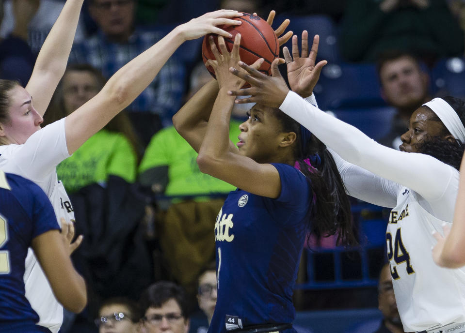 Pittsburgh's Danielle Garven (1) tries to shoot while defended by Notre Dame's Jessica Shepard, left, and Arike Ogunbowale (24) during an NCAA college basketball game Thursday, Jan. 3, 2019, in South Bend, Ind. (Michael Caterina/South Bend Tribune via AP)