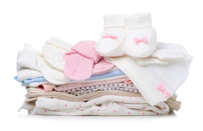 Stack of baby clothes and socks