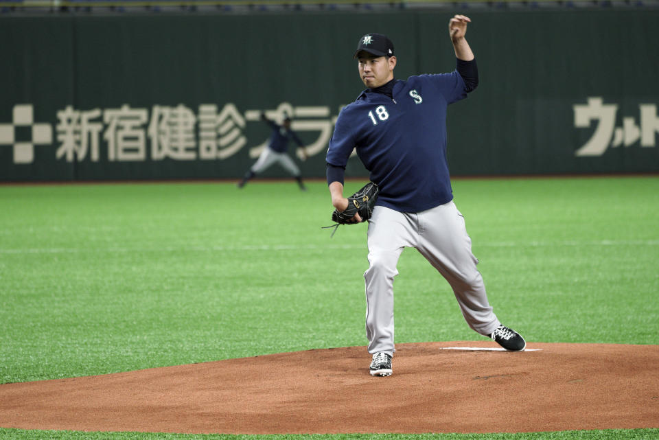 Seattle Mariners pitcher Yusei Kikuchi swings his left arm on the mound during his team's practice at Tokyo Dome in Tokyo, Saturday, March 16, 2019. Just as he was adjusting to life in the United States, Kikuchi is back in Japan getting ready to make his Major League pitching debut in front of a sellout crowd at Tokyo Dome. Kikuchi will be on the mound in Game 2 of the MarinersÅf season-opening series in Japan. (AP Photo/Eugene Hoshiko)