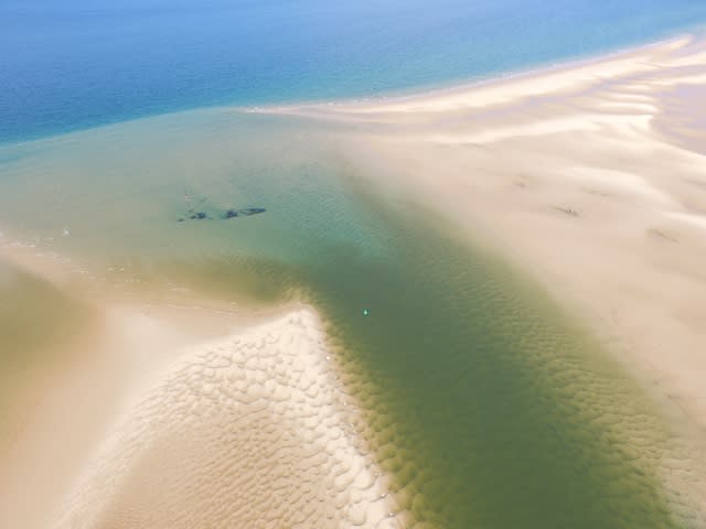 Aerial images show WW1 wreck emerging from sea