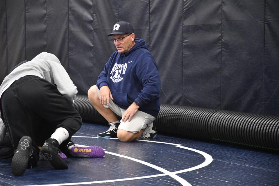 Redwood High School wrestling coach Dave Watts observes practice on Feb. 7, 2024 in Visalia.