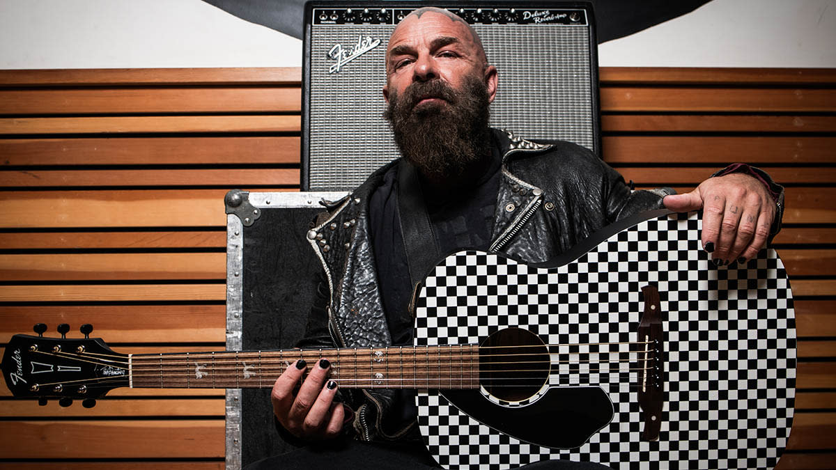  Tim Armstrong holds his new signature Fender Hellcat guitar 