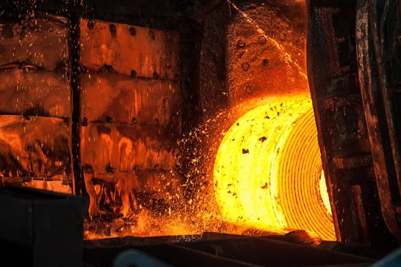 A hot roll of steel in a steel mill.