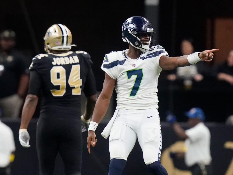 Geno Smith signals before a play against the New Orleans Saints.