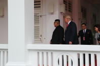 <p>President Donald Trump walks with North Korean leader Kim Jong Un at the Capella Hotel on Sentosa island in Singapore June 12, 2018. (Photo: Jonathan Ernst/Reuters) </p>