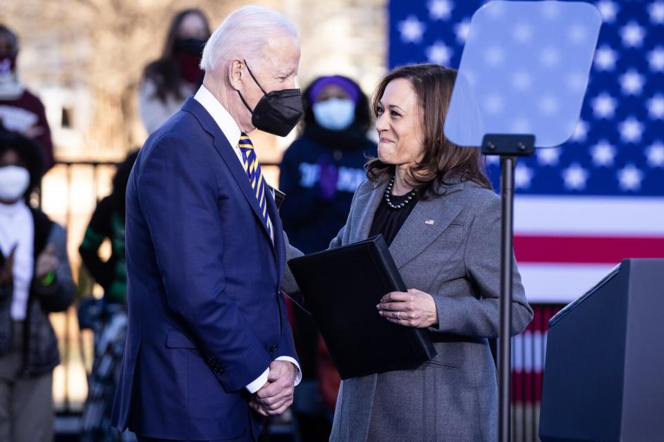 U.S. President Joe Biden shakes hands with Vice President Kamala Harris