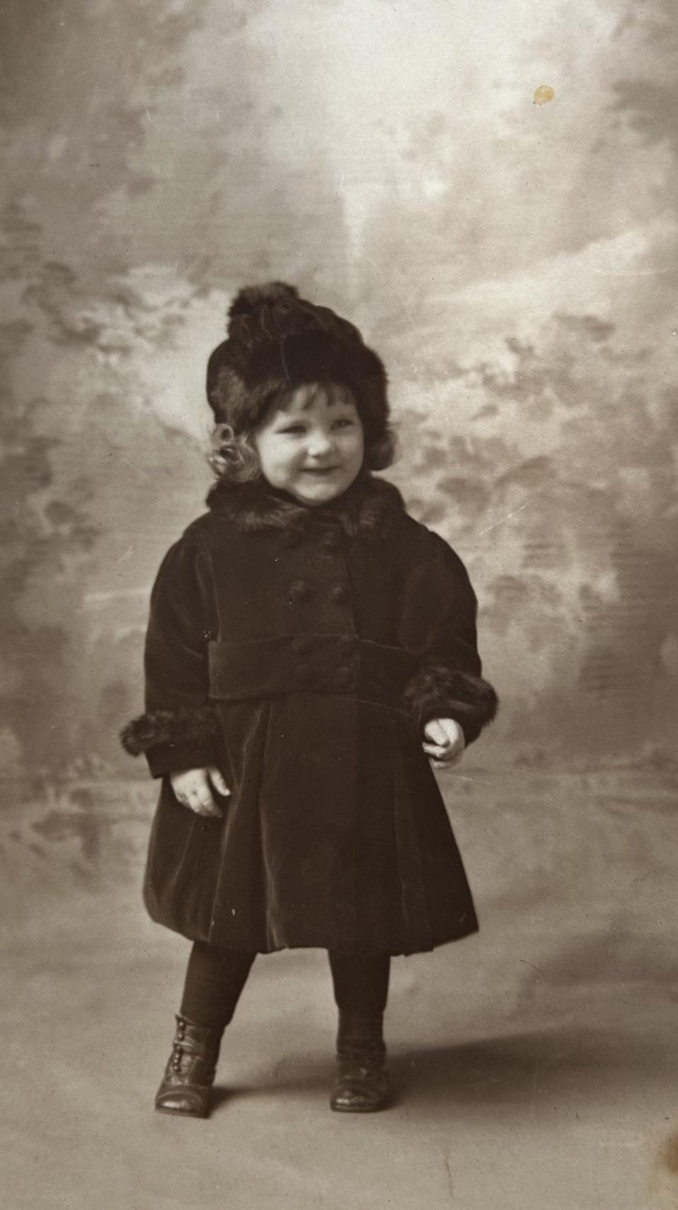 Bobbie West, at age 2, in Binghamton, N.Y. "My first fur coat," she says.