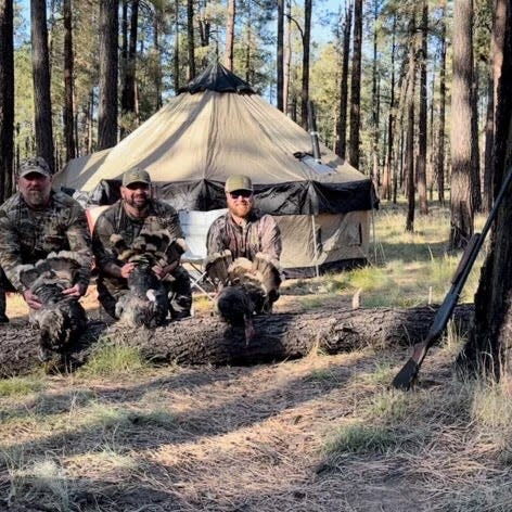 Nate Bartlett, Chris Villescas and Matt Bartlett (L-R) with the turkeys they hunted in the Apache National Forest.