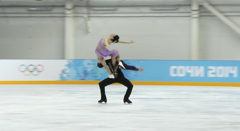 Meryl Davis and Charlie White of the United States skate at the figure skating practice rink ahead of the 2014 Winter Olympics, Wednesday, Feb. 5, 2014, in Sochi, Russia. (AP Photo/Ivan Sekretarev)