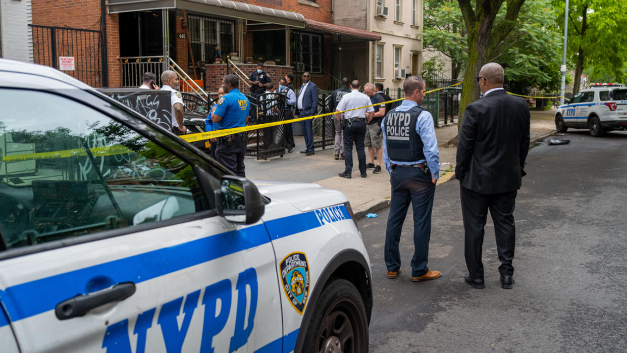 Police at the scene of a shooting in Brooklyn, N.Y., that left one person dead on June 16
