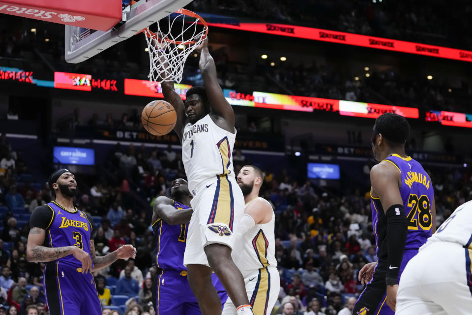 New Orleans Pelicans forward Zion Williamson (1) slam dunks in the first half of an NBA basketball game against the Los Angeles Lakers in New Orleans, Sunday, Dec. 31, 2023. The New Orleans Pelicans won 129-109. (AP Photo/Gerald Herbert)