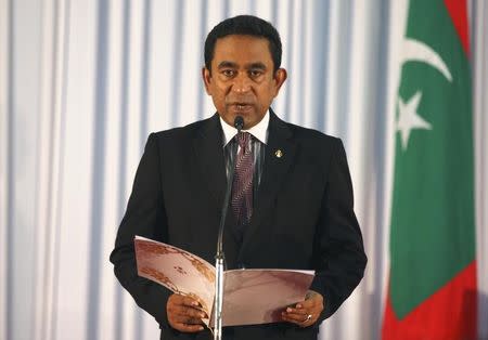 Abdulla Yameen takes his oath as the President of Maldives during a swearing-in ceremony at the parliament in Male November 17, 2013. REUTERS/Waheed Mohamed