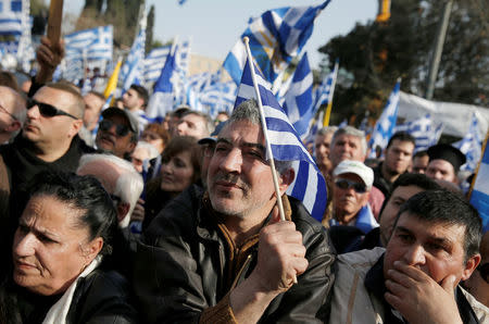 People are seen gathered outside the parliament building during a rally against the use of the term "Macedonia" in any settlement to a dispute between Athens and Skopje over the former Yugoslav republic's name, in Athens, Greece, February 4, 2018. REUTERS/Costas Baltas