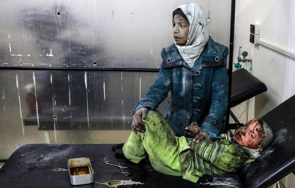 <p>An injured woman holds an injured child at a hospital after alleged airstrikes by forces loyal to the Syrian government hit areas inhabited by civilians in Barzeh, near Damascus, Feb. 20, 2017. According to local witnesses, the airstrikes on the neighborhoods of Barzeh, al-Qabun, and Tishreen, near Damascus, started three days earlier and resulted in the death of at least seven people and injury of some 33 others. (Sarieh Abu Zaid/EPA) </p>