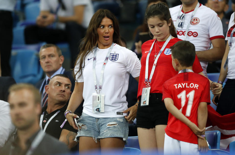 FILE - In this Monday, June 18, 2018 file photo, Rebekah Vardy, wife of England's forward Jamie Vardy, reacts their match against Tunisia at the 2018 soccer World Cup in the Volgograd Arena in Volgograd, Russia. The wives of two of English soccer’s most high-profile players have on Wednesday, Oct. 9, 2019 become embroiled in a spat on Twitter about the leaking of information to a tabloid newspaper. Wayne Rooney’s wife accused Jamie Vardy’s wife of informing The Sun about details of her private Instagram stories. (AP Photo/Frank Augstein, file)