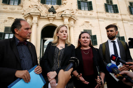 Rebecca Vincent of Reporters Without Borders, Courtney Radsch of the Committee to Protect Journalists, and other delegations members from PEN International and the European Centre for Press and Media Freedom talk to journalists after a meeting with Maltese Prime Minister Joseph Muscat about the assassination of anti-corruption journalist Daphne Caruana Galizia, outside the Auberge de Castille in Valletta, Malta October 15, 2018. REUTERS/Darrin Zammit Lupi