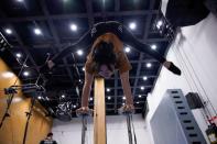 A performer trains for the Cirque du Soleil "The Land of Fantasy" show in Hangzhou