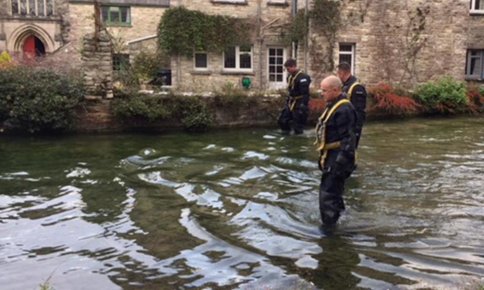 A police team searches a mill pond in Swanage, Dorset, after 19-year-old Gaia Pope disappeared a week ago.