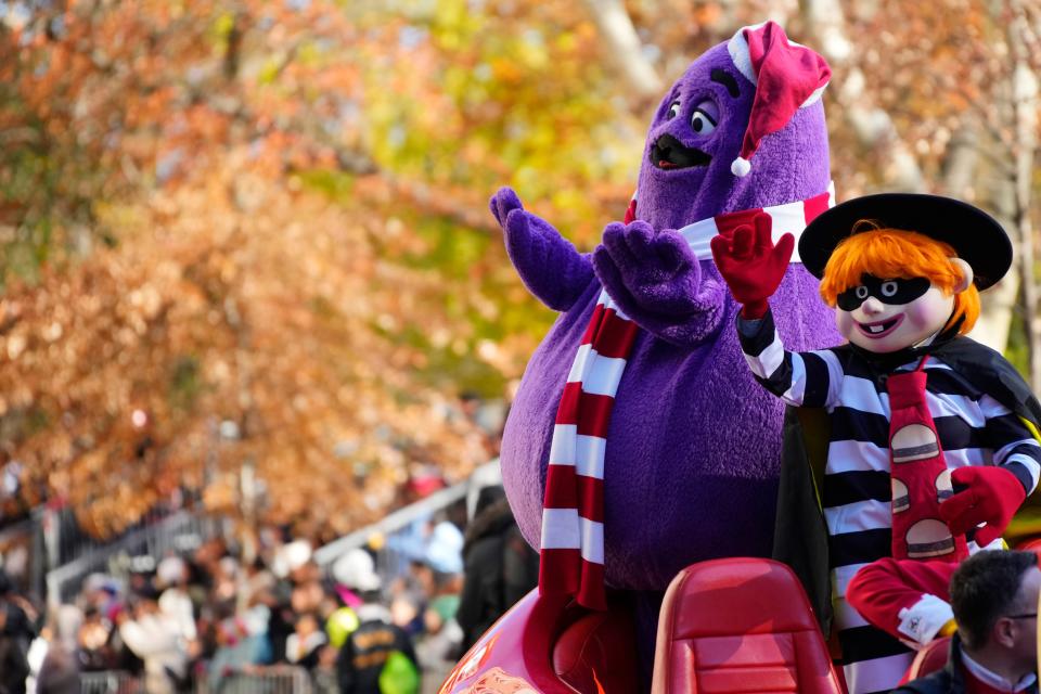 McDonald's characters Grimace and the Hamburglar ride a float in the Macy's Thanksgiving Day Parade on Thursday, Nov. 23, 2023, in New York. (Photo by Charles Sykes/Invision/AP)