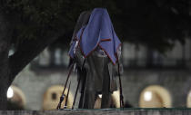 <p>Confederate statutes removed from the University of Texas are secured to a trailer, early Monday morning, Aug. 21, 2017, in Austin, Texas. University of Texas President Greg Fenves ordered the immediate removal of statues of Robert E. Lee and other prominent Confederate figures from a main area of campus Sunday night, saying such monuments have become “symbols of modern white supremacy and neo-Nazism.” (AP Photo/Eric Gay) </p>