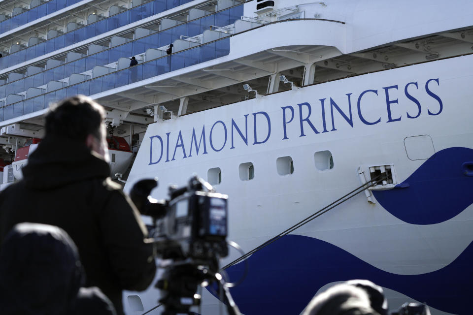 The cruise ship Diamond Princess is anchored at Yokohama Port for supplies replenished in Yokohama, south of Tokyo, Thursday, Feb. 6, 2020. Health workers said 10 more people from the Diamond Princess were confirmed ill with the virus, in addition to 10 others who tested positive on Wednesday. They were dropped off as the ship docked and transferred to nearby hospitals for further test and treatment. (AP Photo/Eugene Hoshiko)