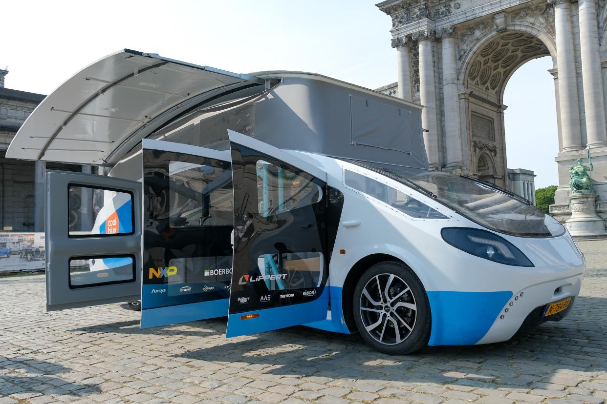 Photo taken on Sept. 20, 2021 shows Stella Vita, a solar-powered recreational vehicle, in Brussels, Belgium.  Designed by the solar team of Eindhoven University of Technology, Stella Vita is equipped with solar panels on the roof, through which the vehicle generates enough energy to drive, shower, watch TV, charge, etc. By using energy efficiently, Stella Vita can travel up to 730 km on a sunny day. (Photo by Zhang Cheng/Xinhua via Getty Images)