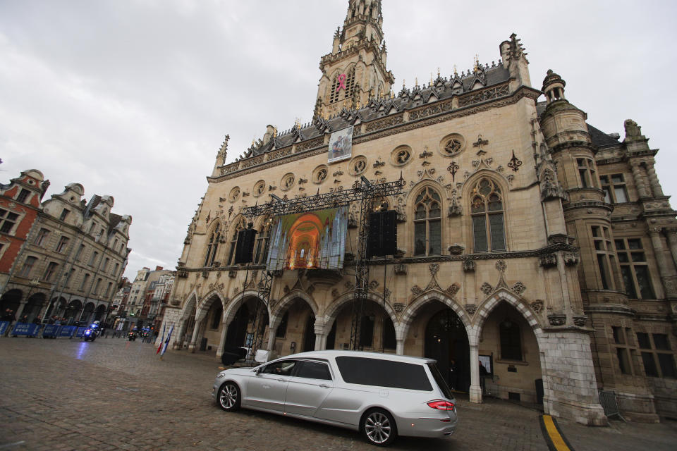 The hearse with the coffin of late French teacher Dominique Bernard, 57, who was stabbed to death at the school by a suspected Islamist extremist, arrive for the funeral ceremony, in Arras, northern France, Thursday, Oct. 19, 2023. (AP Photo/Michel Spingler)